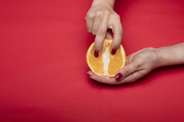 A Person Holding an Orange Fruit