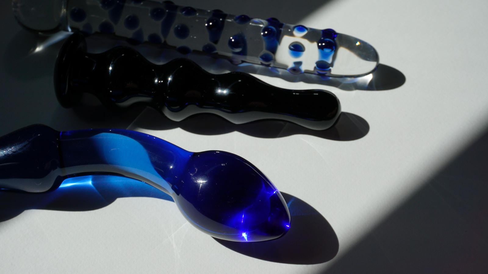 purple and black glass spoon pipe